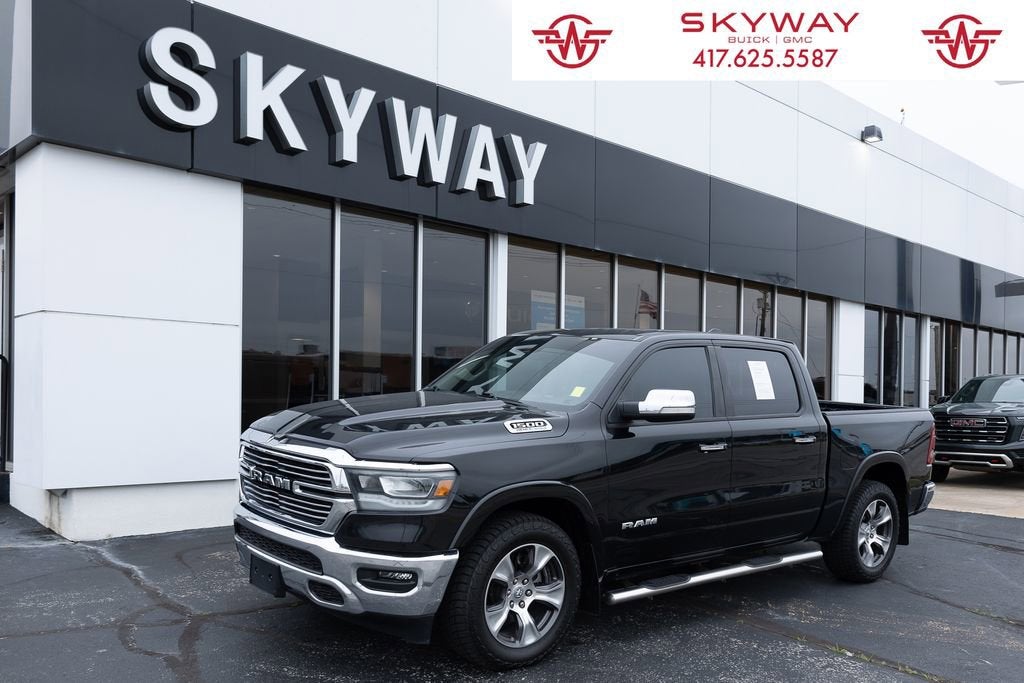 2022 RAM 1500 Laramie Crew Cab 4x4 5'7" Box in Black — front three-quarter view