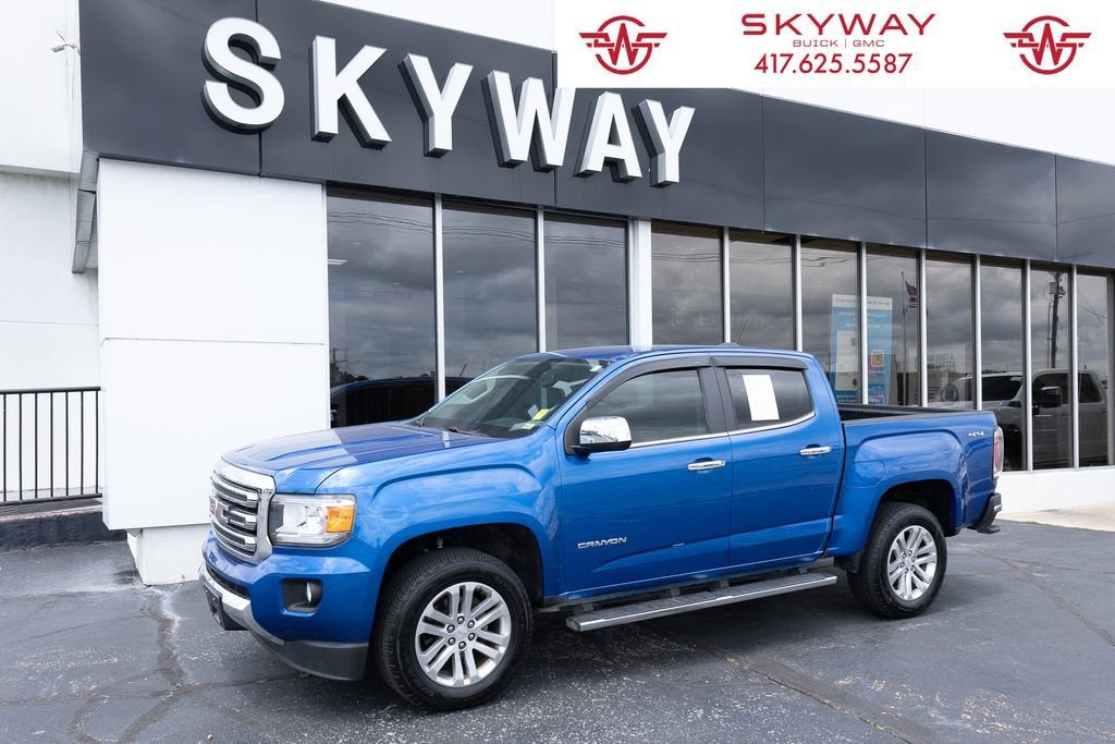 2019 GMC Canyon 4WD SLT in Marine Blue Metallic — front three-quarter view