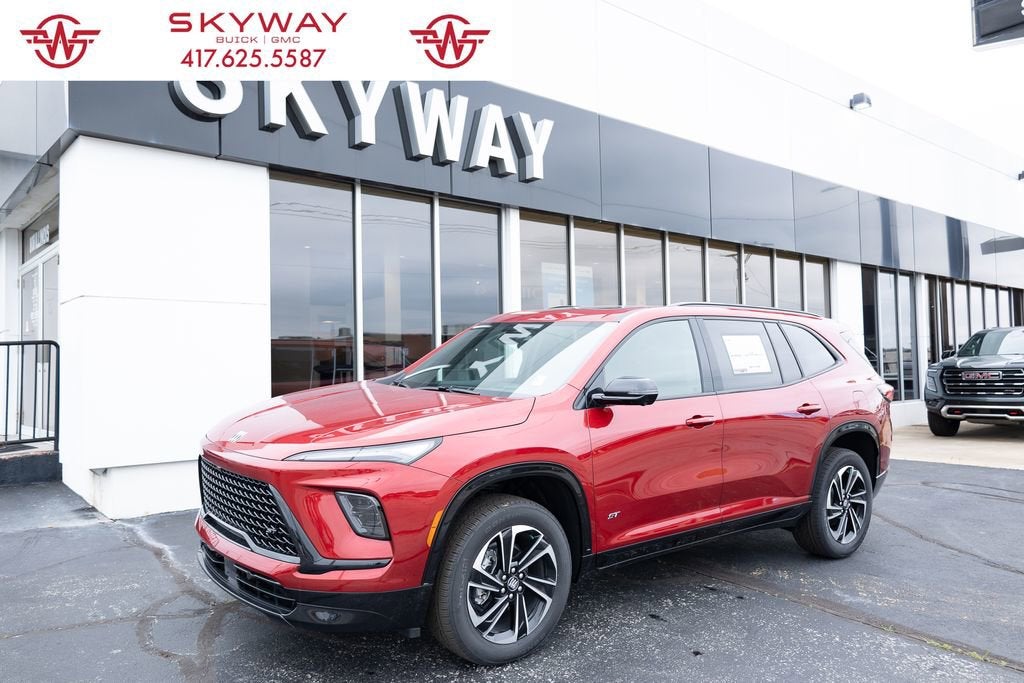 2026 Buick Enclave Sport Touring in Cherry Red Tintcoat — front three-quarter view