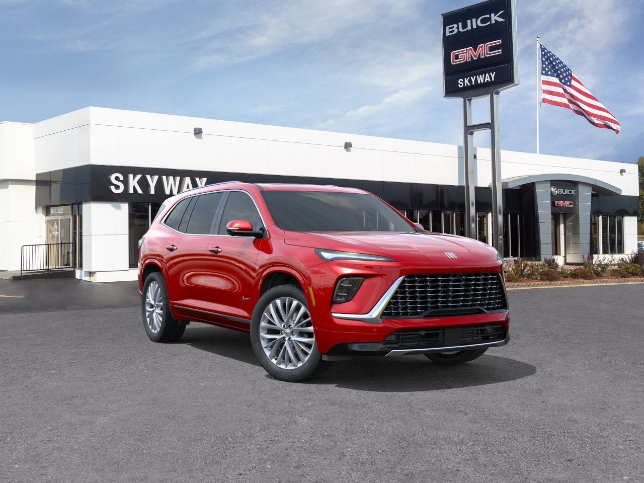 2026 Buick Enclave Avenir in Cherry Red Tintcoat — front three-quarter view