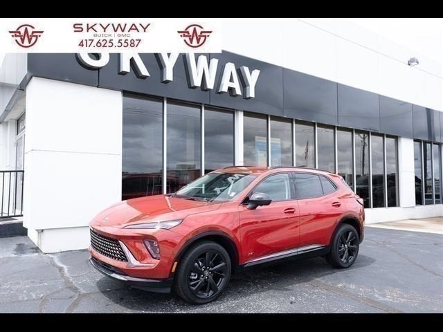 2026 Buick Envision Sport Touring in Brilliant Red — front three-quarter view